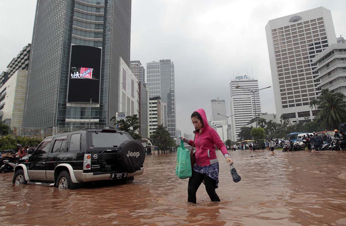 Woman walking in the flood